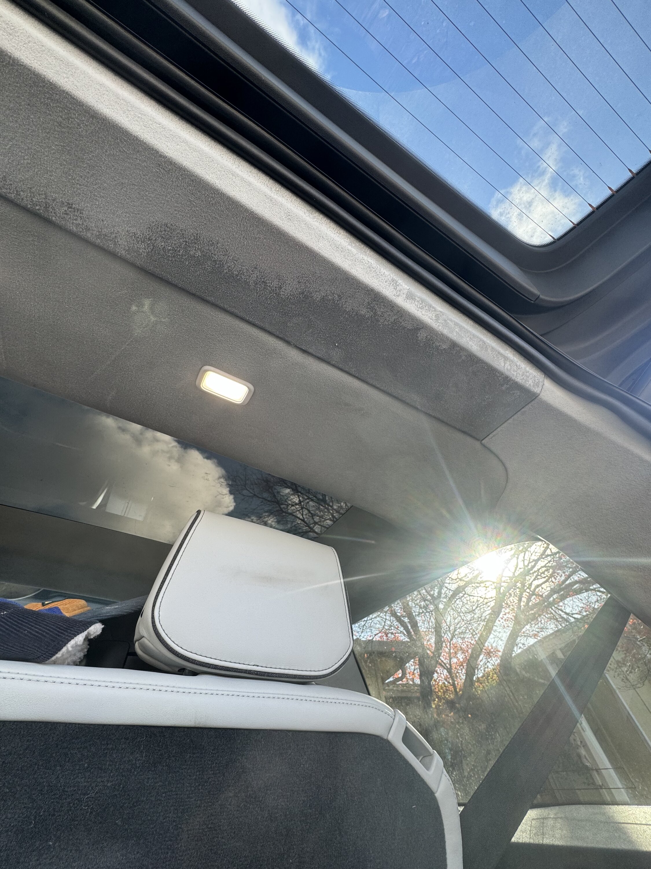 Rivian R1T R1S Roof leak in new R1S - water dripping out of the sun visor hole IMG_4356