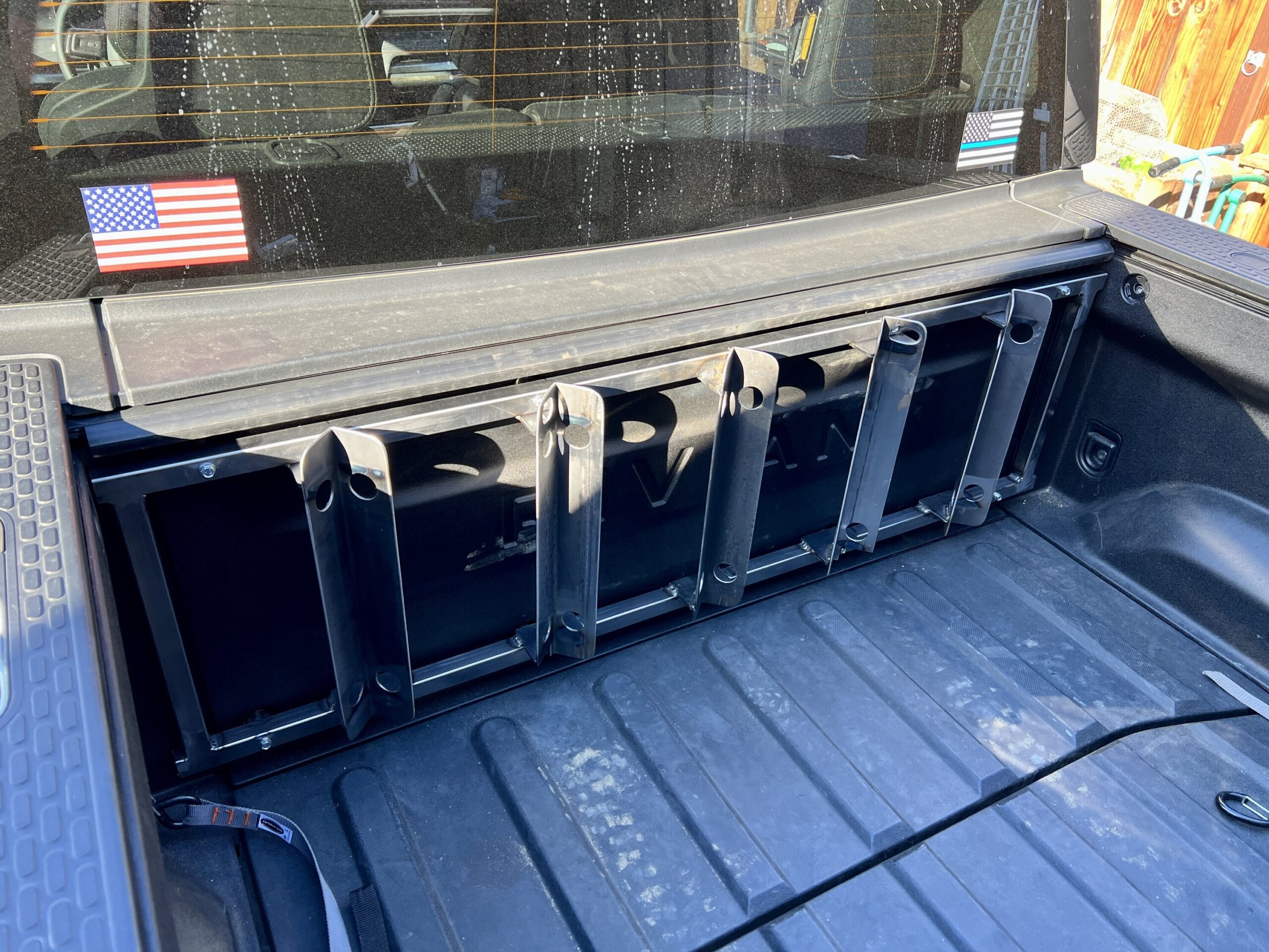 Motorcycle wheel chock system installed in the bed. Just needs a coat