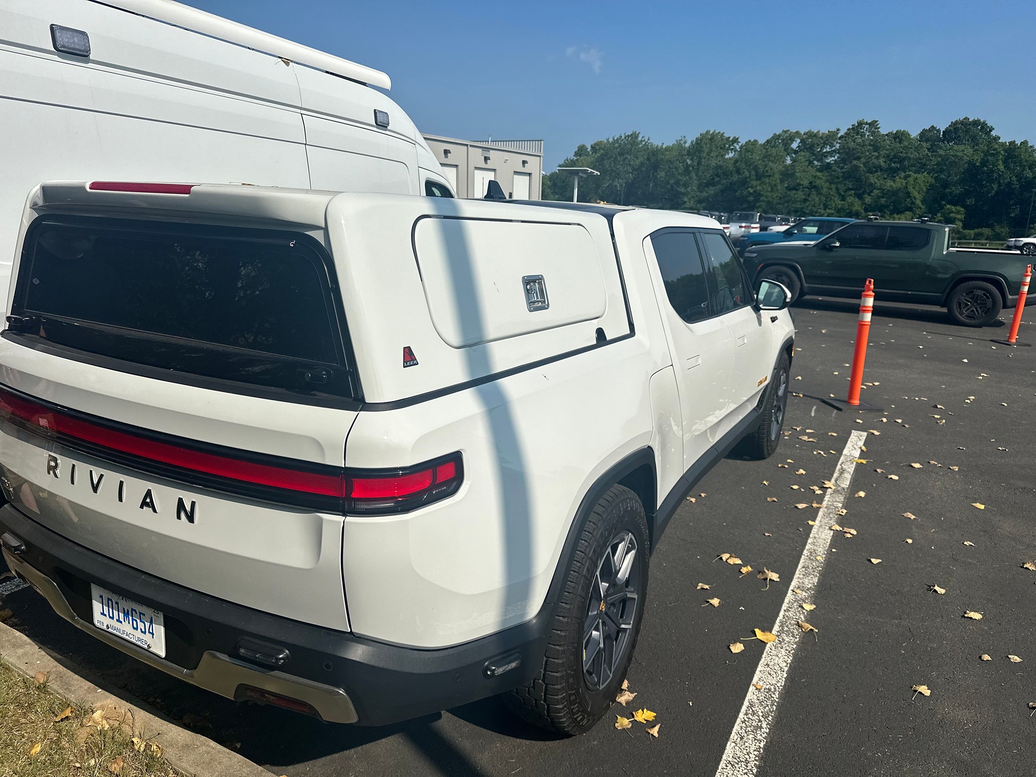 Leer Bed Cap Topper and Brush Guard spotted on Rivian R1T manufacturer plated vehicle Rivian